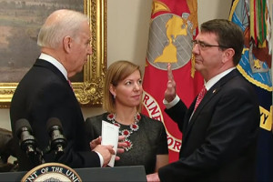 Vice President Joe Biden swears in Ash Carter as the 25th defense secretary as Carter's wife, Stephanie, looks on during a private ceremony at the White House, Feb. 17, 2015. DoD screen shot