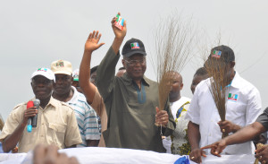 Former Governor Oserheimen Osunbor displays his APC membership card flanked by Governor Adams Oshiomhole (left) and Hon Anselm Ojezua, Chairman, All Progressives Congress during the decamping of the former Governor to the All progressives Congress in Edo State, yesterday