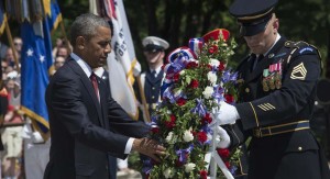 US President Barack Obama lays a wreath at the Tomb of the Unknowns during Memorial Day ceremonies on May 25, 2015 at Arlington National Cemetery in Arlington, Virginia. Memorial Day, originally called Decoration Day, is a day of remembrance for those who have died in service of the United States of America