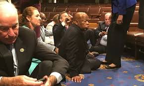  A group of Democrats led by the civil rights veteran John Lewis occupied the “well” in front of the dais, demanding a vote on gun control measures in the wake of the Orlando massacre.